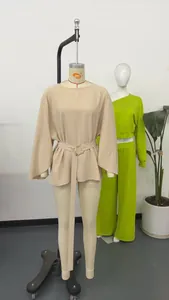 Elegant French retro bell sleeve top with round neck and belt shown on a mannequin display