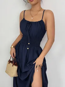 Navy blue sleeveless camisole dress with smocked waist and drawstring neckline detail.
