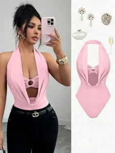 Stylish pink halter neck bodysuit featuring a deep V cutout and metal ring detail.