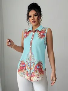 Detailed view of women's sleeveless collared blouse with intricate colorful paisley print