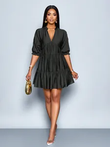 Elegant black puff sleeve mini dress with deep V-neck and tiered pleated hem design