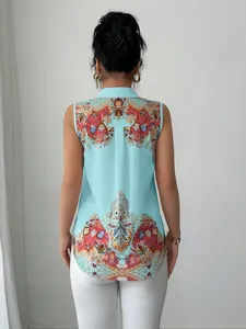 Back view of a sleeveless turquoise shirt with intricate ethnic paisley print