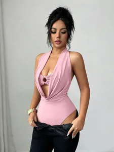Close-up of pink deep V halter bodysuit featuring central ring detail and slim fit.