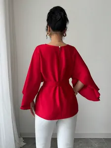 Elegant red French vintage bell sleeve blouse with waist belt shown from the back view