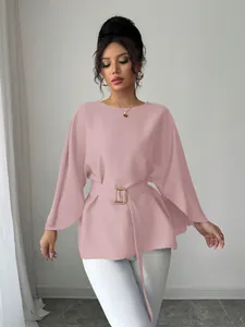 Elegant French vintage pink blouse featuring flared sleeves and a gold buckle belt