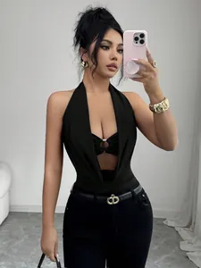 Detail of sexy black halter neck bodysuit with deep V cutout and ring