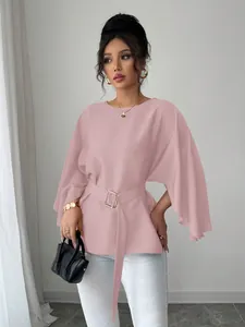 Elegant dusty pink French vintage blouse featuring flare sleeves and a matching belted waist.