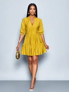 Elegant mustard yellow deep V-neck pleated dress with puffed sleeves for fashion styling