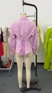 Detailed back view of a pink striped long sleeve shirt with adjustable lace-up waist design