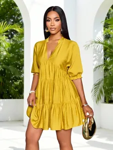 Elegant yellow tiered mini dress with deep V-neck and puff sleeves for summer fashion