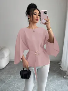 Detail of pink French vintage blouse with bell sleeves and buckled waist belt