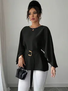 Elegant black flare sleeve blouse with gold buckle belt detail and round neck design.