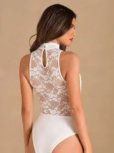 Back view of white high-neck bodysuit with floral lace panel and keyhole cutout