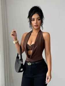Detail view of a brown halter bodysuit featuring a deep V-cut and central ring detail