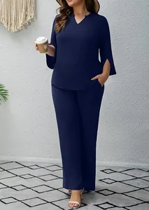 Full-body detail of a navy blue two-piece set featuring a V-neck top and wide-leg pants.