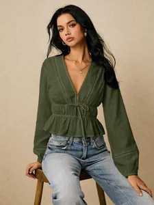 Elegant olive green deep V-neck blouse featuring hollow-out lace and peplum hem.