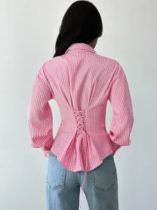 Back detail of pink striped long sleeve shirt with adjustable corset lace-up waist