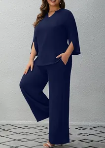 Full view of navy blue two-piece set featuring a V-neck top and wide-leg trousers