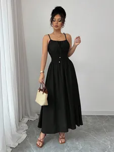 Detail view of black smocked waist spaghetti strap maxi dress on model