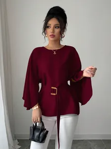Elegant burgundy French vintage blouse featuring stylish flared sleeves and a belted waist.