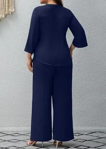 Back view of a chic navy blue two-piece set featuring textured tunic and wide-leg pants.