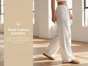Close-up of white pure cotton wide-leg trousers showing loose fit and soft texture