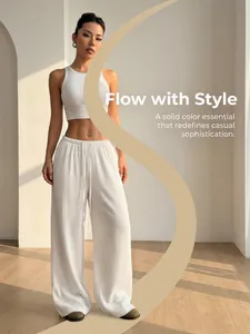 Modern white textured wide-leg pants for a sophisticated and casual lounge look.