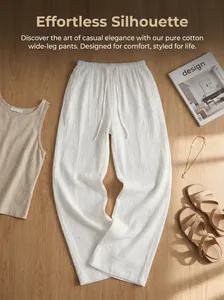 Close-up detail of white pure cotton wide-leg pants with natural textured fabric style