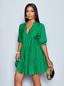 Elegant green mini dress featuring deep V-neck and ruffled tiered puff sleeves