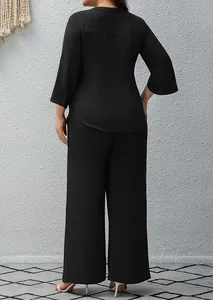 Back view of a black two-piece crinkle fabric set with 3/4 sleeve top and wide leg pants