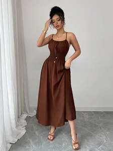 Elegant brown spaghetti strap dress with smocked waist and drawstring neckline detail
