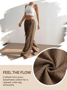 Detailed view of breathable pure cotton fabric on brown wide-leg relaxed trousers