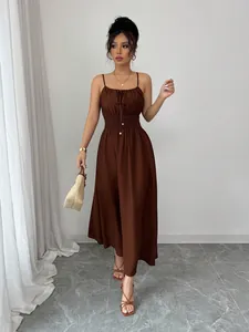 Elegant brown sleeveless strappy midi dress with smocked waist and gathered bust detail.