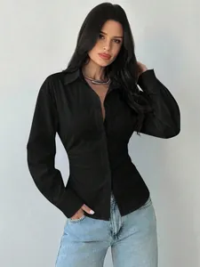 Detail shot of a women's slim-fit long-sleeve black button-down shirt with V-neck