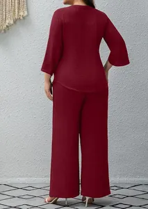 Back view of burgundy two-piece set featuring textured fabric and wide-leg trousers.