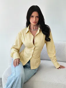 Detailed view of a yellow and white striped long sleeve slim fit shirt on a model