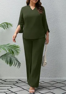 Detail of olive green two-piece set featuring split sleeves and wide leg pants