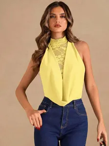 Detailed view of yellow halter neck bodysuit with lace paneling and cowl neckline.