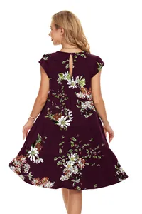 Back view of a bohemian purple floral tiered dress featuring a round neck and short sleeves