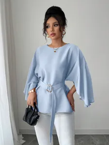 Elegant light blue French vintage style blouse featuring bell sleeves and a matching waist belt