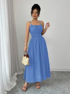 Detailed view of a chic blue camisole maxi dress with smocked waist and tie-front detail