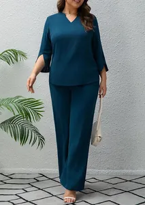 Plus size teal two-piece set with V-neck slit sleeve top and wide-leg pants