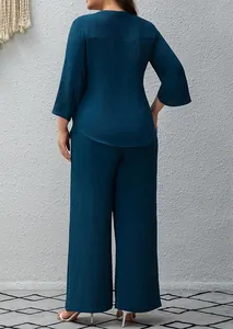 Back view of teal crinkle texture two-piece set with tunic and wide leg pants