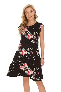 Detailed view of a black floral tiered dress with round neck and short sleeves for summer
