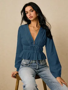 Elegant blue deep V-neck blouse featuring ruffles and a cinched waist for women
