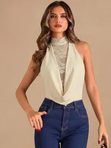 Detail of a beige halter neck bodysuit featuring lace high collar and elegant cowl neck