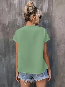 Back view of a sage green short sleeve summer blouse for women with casual style