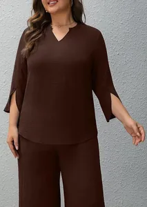 Detail view of a chocolate brown two-piece set featuring split sleeves and wide leg pants