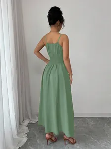 Back view of sage green maxi dress with thin straps and smocked waist detail