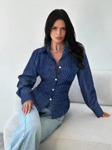 Detailed shot of a navy blue striped slim fit shirt with single-breasted buttons